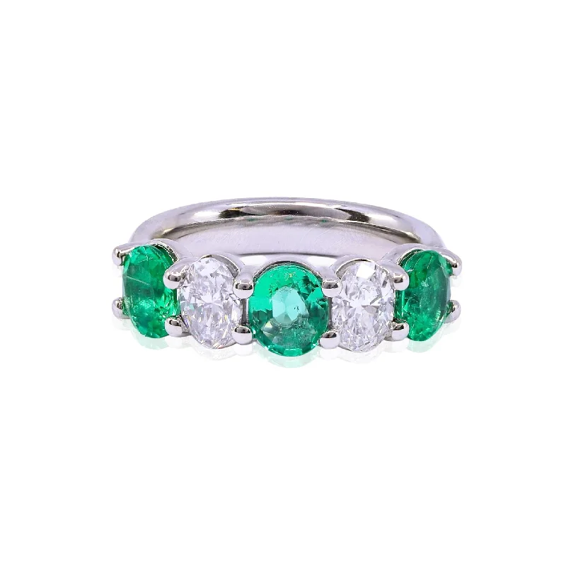 PLATINUM OVAL EMERALD AND DIAMOND RING