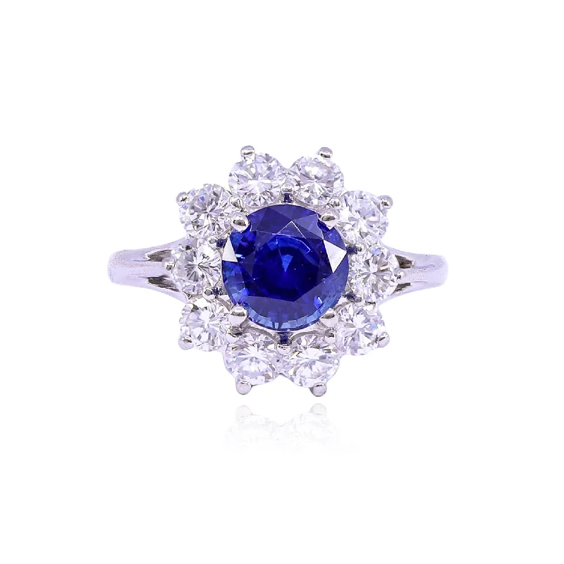 ESTATE PLATINUM SAPPHIRE AND DIAMOND HALO RING