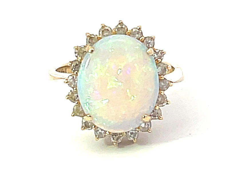 Opal and Diamond Halo Ring in 14k Yellow Gold